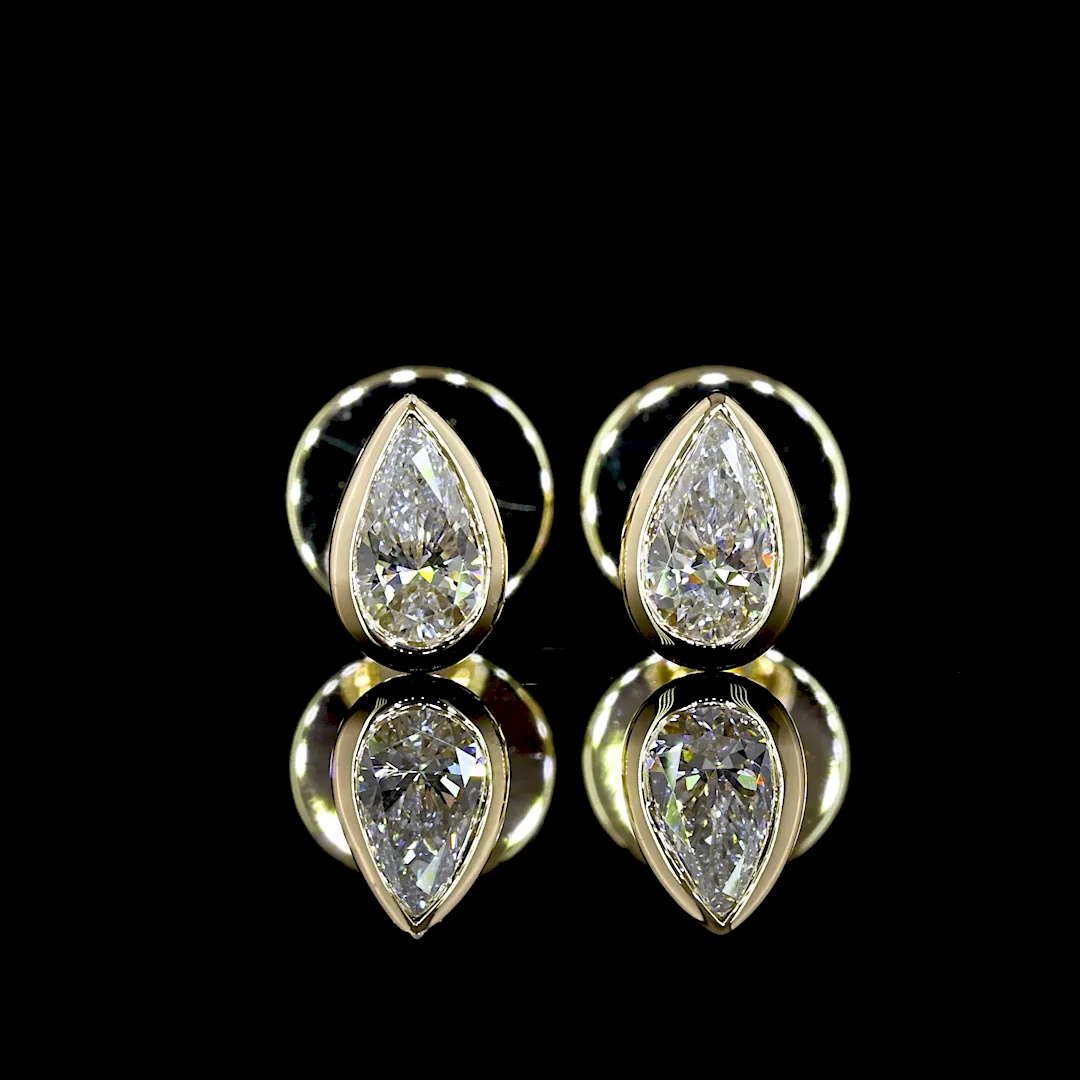 0.3 Cts 14k Yellow Gold Pear Shape Studs Earring - Video