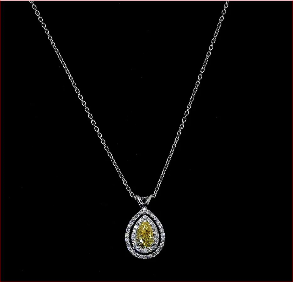 0.77 Cts 14k White Gold Pear Shape Double Halo Pendant
